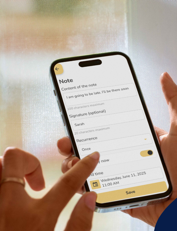 Person holding the Idem app with a note-taking app open on a blurred background