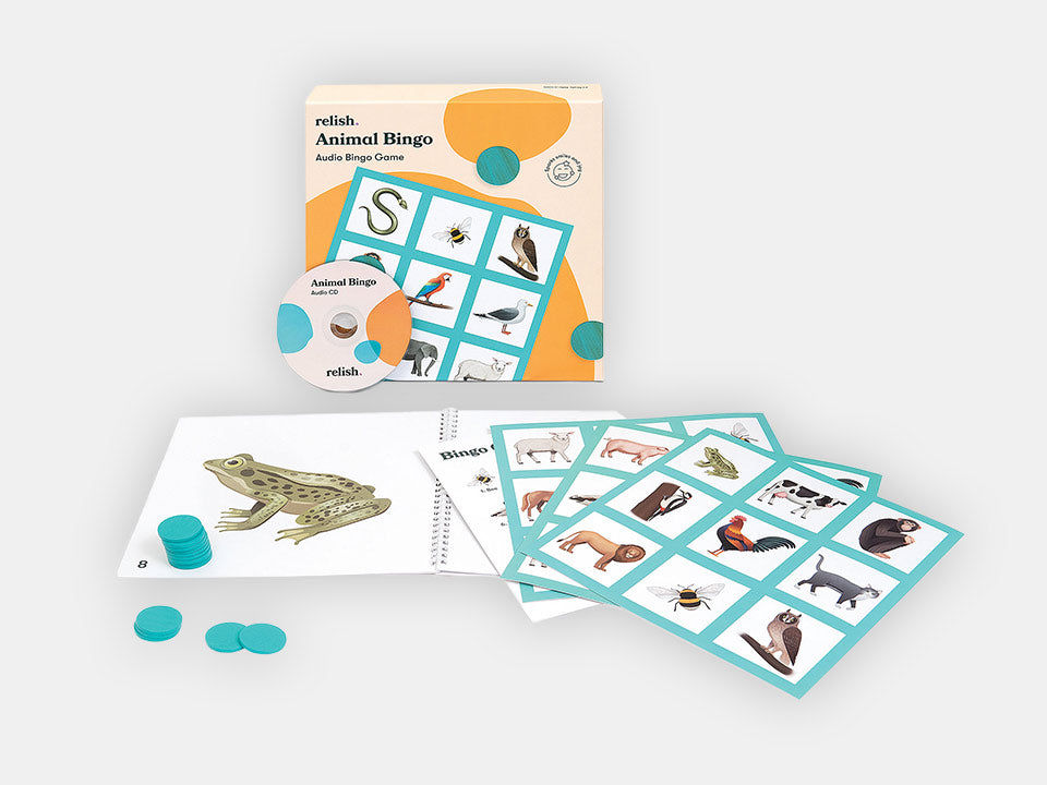 The box and different components from the turquoise Animal Bingo Game.