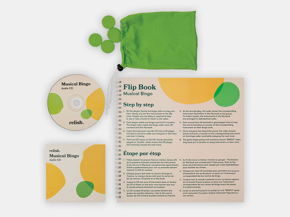 Different components of the Musical Bingo Game like its green chips and Audio CD.