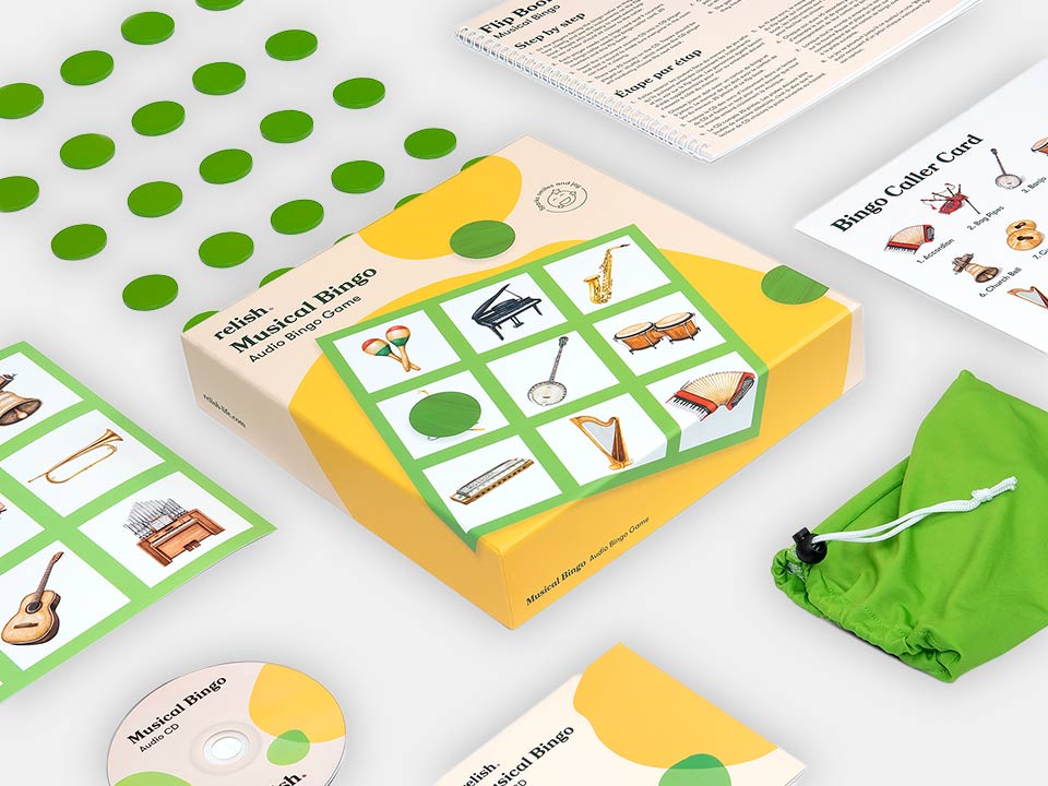 Layed-out components of the Relish Musical Audio Bingo Game with its green colours.