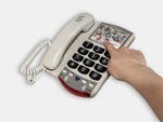 The Clarity Phone with a hand using a picture button . 
