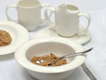 The Feeding Cup, with the Adaptive Bowl, Adaptive plate, Saucer and Two Handled Cup