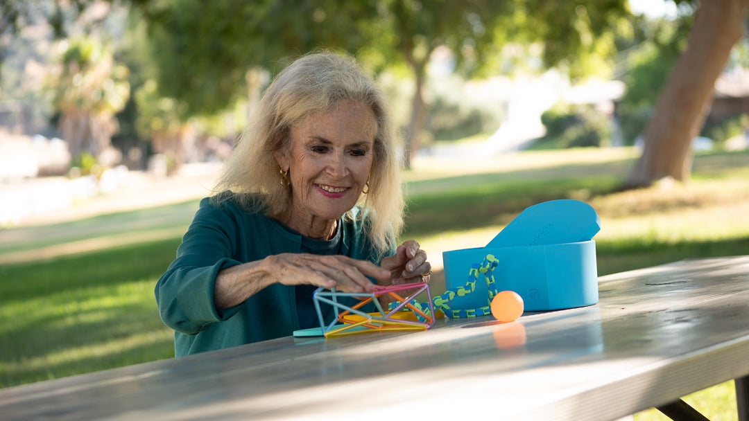 A woman playing with the Geri-Gadget