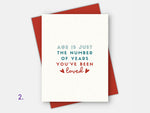 Age friendly Birthday Card: ''Age is just a number of years you've been loved'' with a red envelope.
