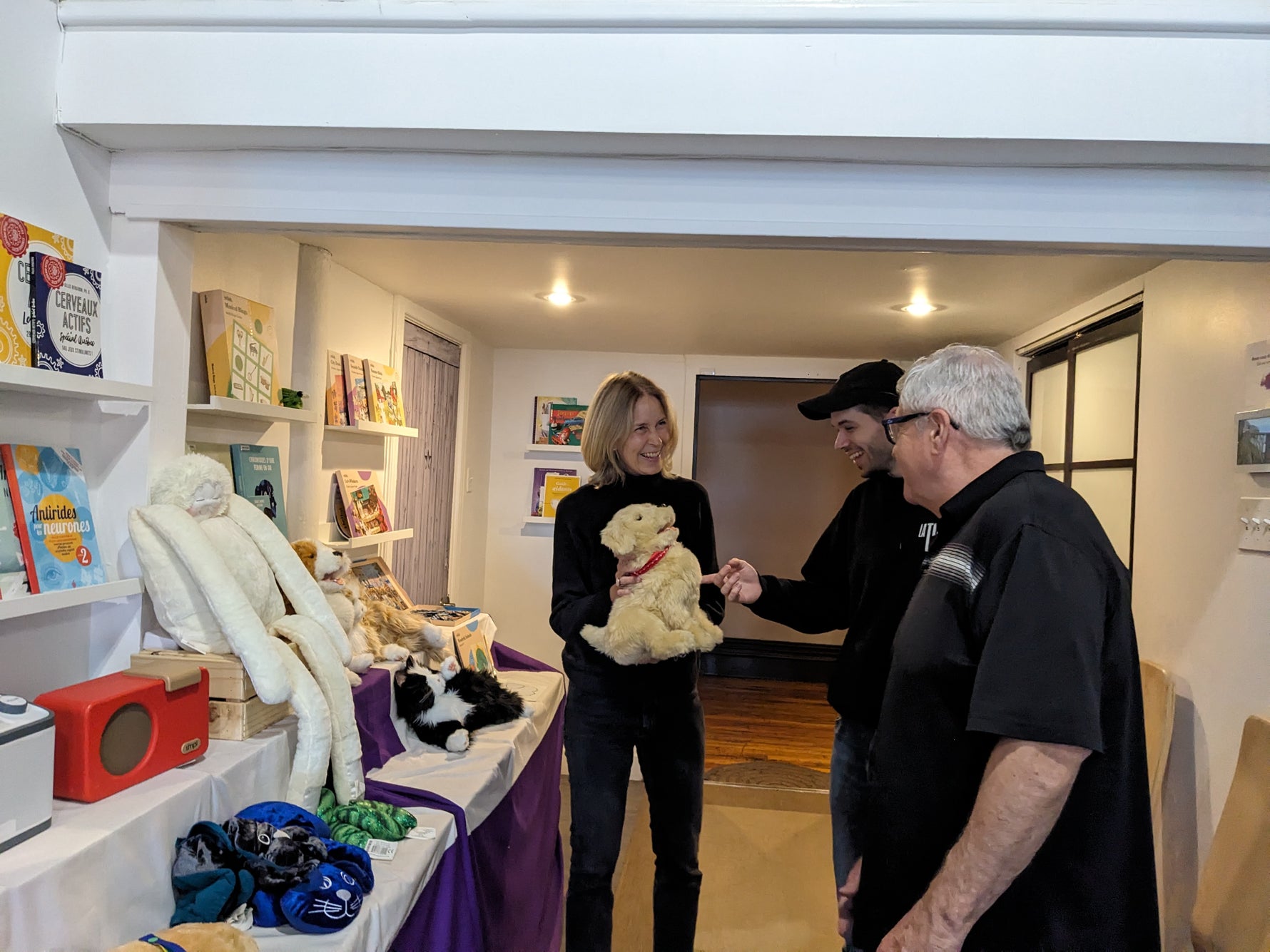 Three people interacting in the Eugeria boutique