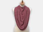 Protective pashmina bib for older adults in burgundy with white polka dots pattern.