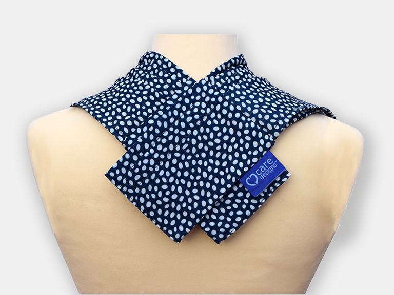 Close-up view of the back of the pashmina bib, showing a criss-cross of textile with velcro as closure.