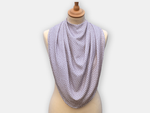 Protective pashmina bib for older adults in the grey with white polka dots pattern.