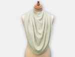 Protective pashmina bib for older adults in the light green with white polka dots pattern.