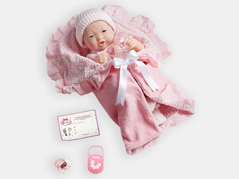 The Asian ''La Newborn'' comfort doll with its pink accessories.