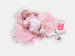 La Newborn'' Caucasian comfort doll with pink accessories.