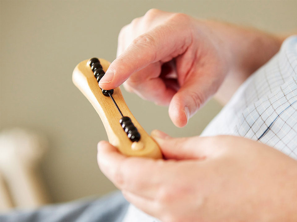 close up of hands playing with one fidget widget