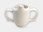Front view of the white two-handle dignity cup that helps prevent spills with the half-opening and pierced spout.