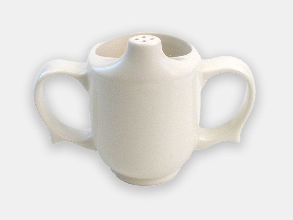 Front view of the white two-handle dignity cup that helps prevent spills with the half-opening and pierced spout.