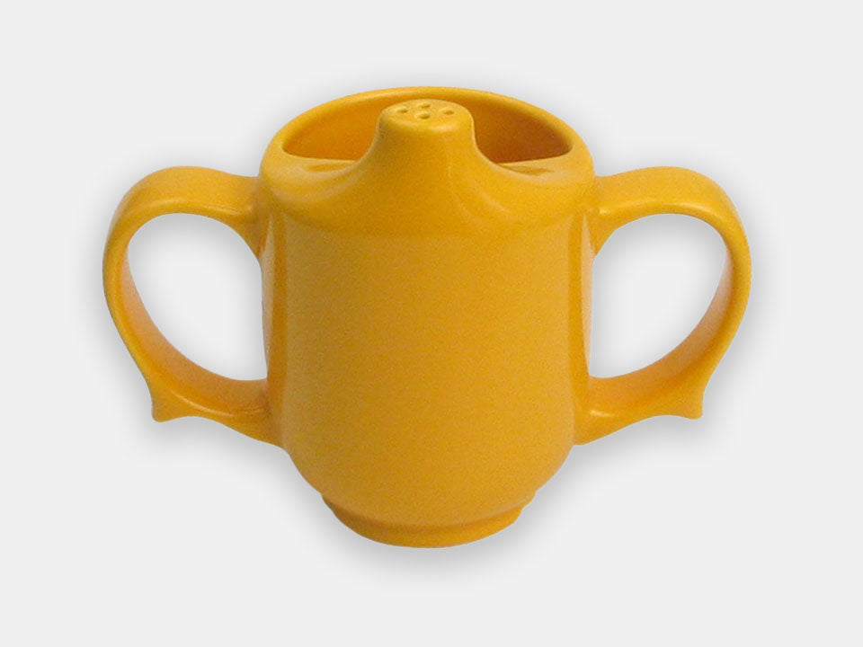 Front view of the yellow two-handle dignity cup that helps prevent spills and maintaind independance.