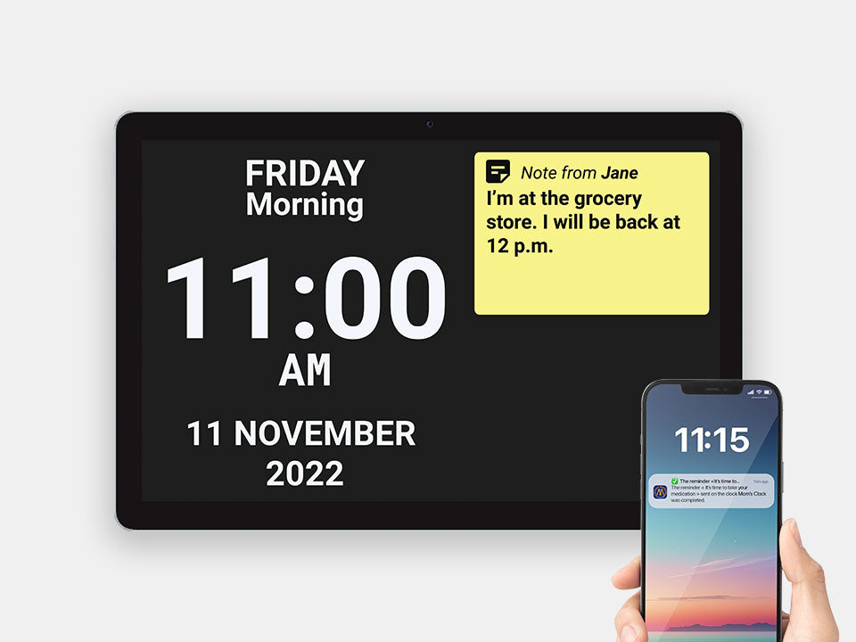Idem Smart Calendar Clock and the caregiver app shown on a phone held by a hand in front of the idem clock.