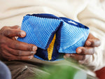 Elderly hands playing with the Relish tactile-turn, a rhythmic toy for people with fidgety hands living with dementia.