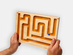 Someone holding the Track Marble Maze