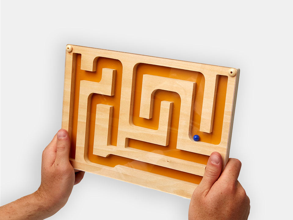 Someone holding the Track Marble Maze