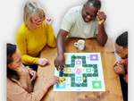 Seniors playing the board game 