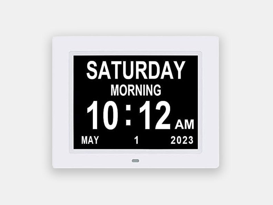 12 alarm Calendar Clock with a white frame made to help with the autonomy of people living with dementia.